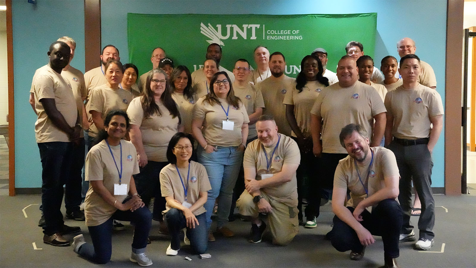 Group photo of people wearing event T-shirt.